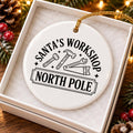 Whimsical Santas Workshop Ceramic Ornament with Gold Ribbon